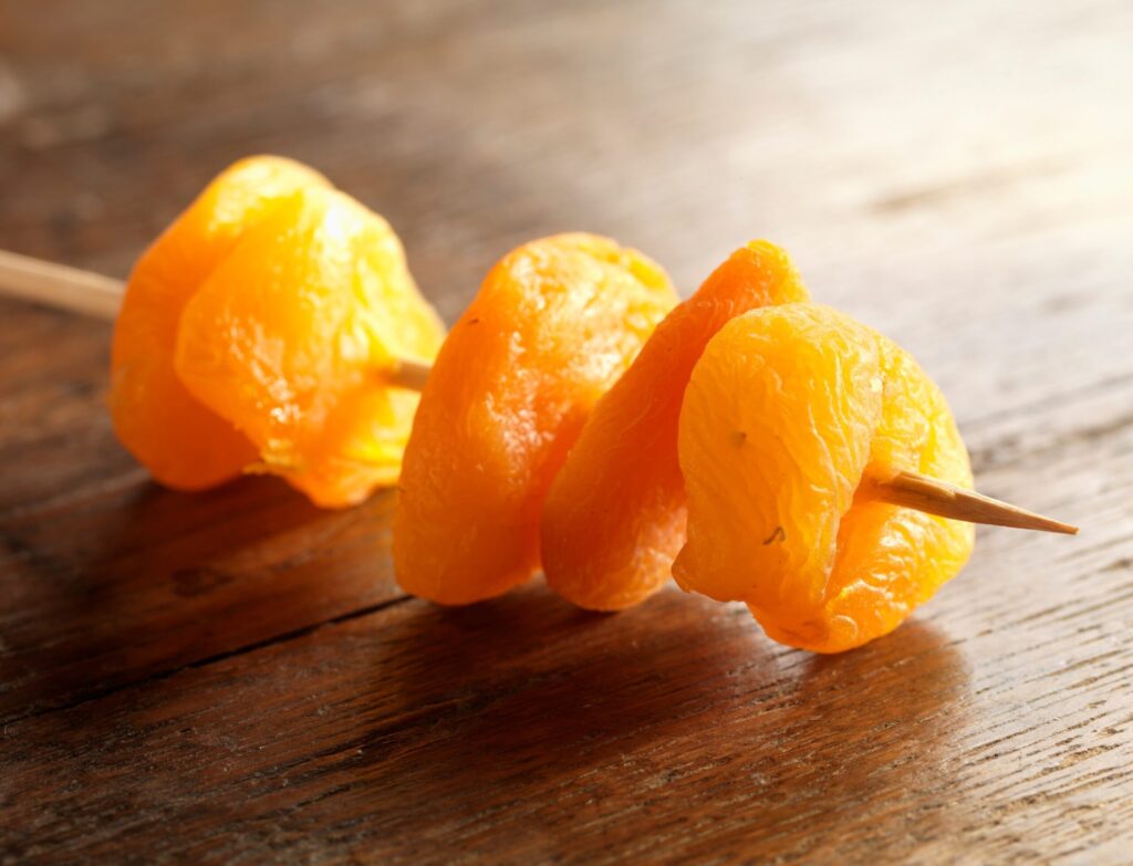 Apricot market update Dried apricot on a skewer.